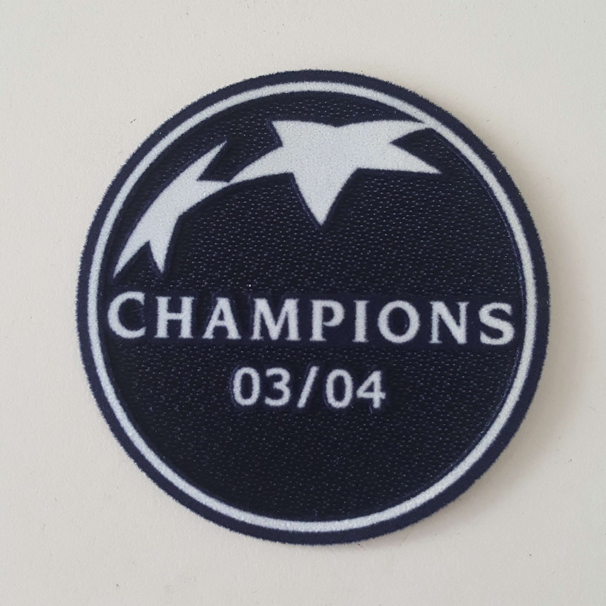UEFA Badge Of Honour 03/04 Champions League Winner Patch - ClassicFootballJersey
